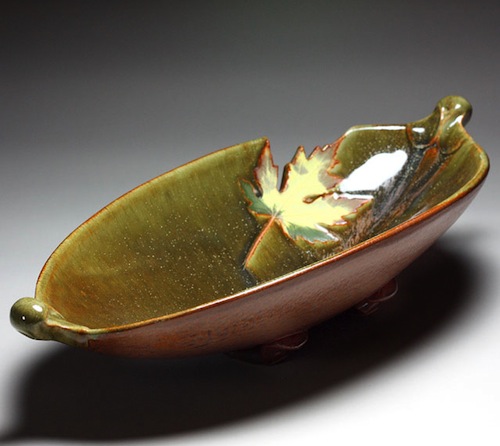 Travis Berning is originally from Marienthal, Kansas. He received his Bachelor of Fine Arts degree from Wichita State University in 1995, before continuing to study at the graduate level at the University of North Texas. In 1998 he returned to Kansas to set up his own studio and spent the next five years as a full-time potter traveling and participating in art shows throughout the United States. His work has been exhibited in shows such as Ceramics USA and published in Clay Times and Southern Living.
<br><br>
When you look at Travis Berning's pottery you can almost feel his life coming through in every facet of his art. His childhood on a farm in Western Kansas made him love the combination of hands-on physicality and sensitivity to nature that is so evident in the strong forms of his pots. In 1991 Travis began his college experience at Garden City Community College on a two-dimensional art scholarship in drawing and painting. After taking a class in ceramics, however, Travis realized he wanted to work with clay. His painting professor urged him to remain in the painting program but it was too late. He had a natural passion for pottery.  He now lives and works in the Ashville, NC area.